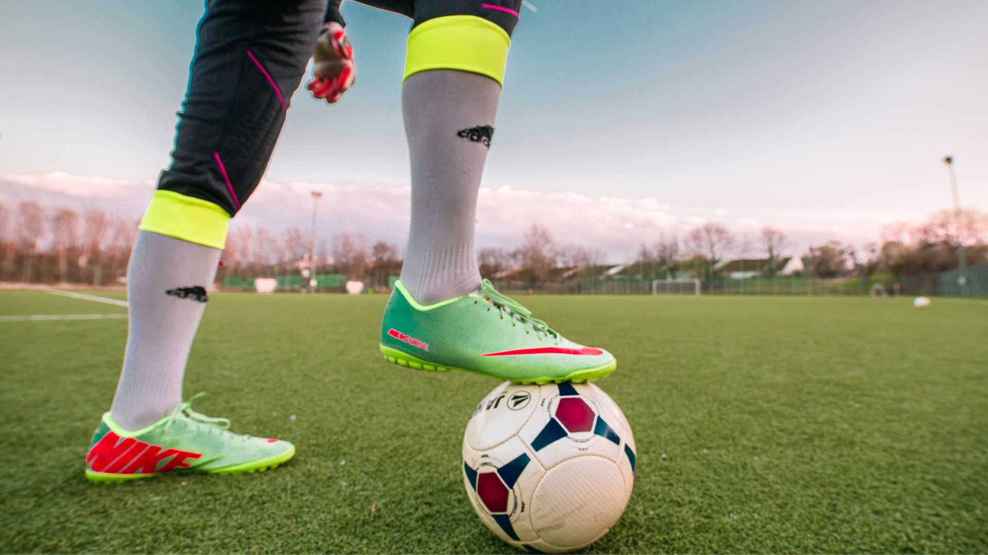 Football pitch under lights with strategy graphics overlay